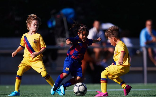 Equips de la Barça Academy disputant un partit